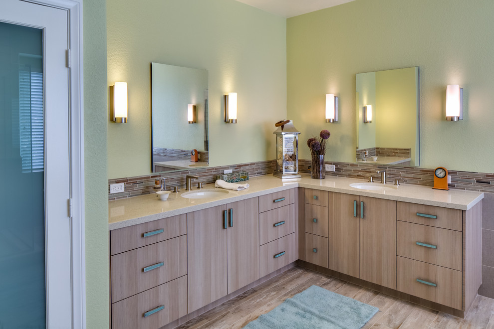 Mid-sized transitional master beige tile and matchstick tile porcelain tile bathroom photo in San Diego with an integrated sink, flat-panel cabinets, light wood cabinets, quartz countertops and green walls