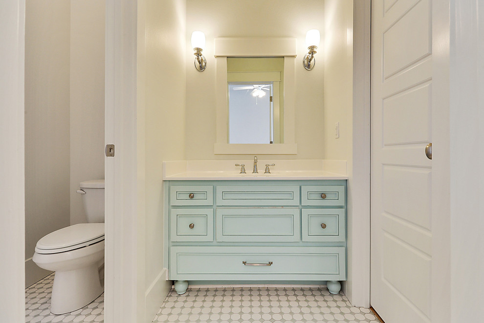Inspiration for a large coastal kids' white tile and ceramic tile ceramic tile bathroom remodel in New Orleans with an integrated sink, open cabinets, blue cabinets, solid surface countertops, a two-piece toilet and white walls
