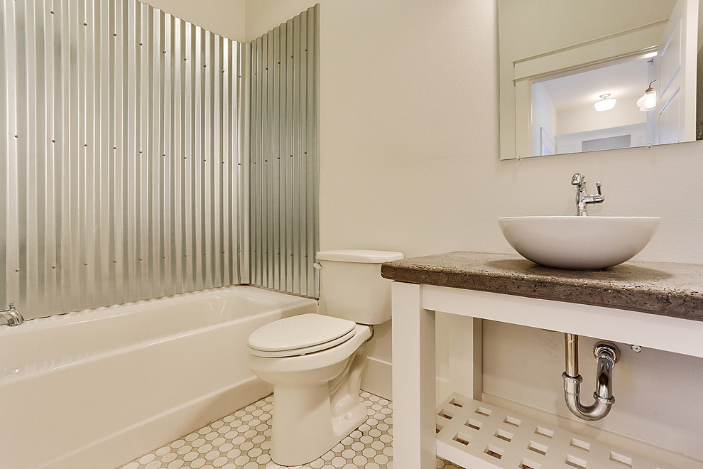 Mid-sized beach style white tile and ceramic tile ceramic tile bathroom photo in New Orleans with a vessel sink, open cabinets, white cabinets, concrete countertops, a two-piece toilet and white walls