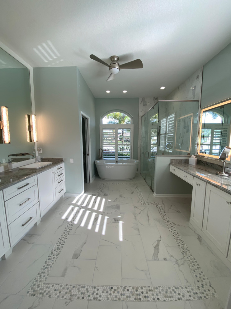 Medium sized traditional ensuite bathroom in Tampa with shaker cabinets, white cabinets, a freestanding bath, a corner shower, multi-coloured tiles, porcelain tiles, green walls, porcelain flooring, a built-in sink, quartz worktops, multi-coloured floors, a hinged door and multi-coloured worktops.