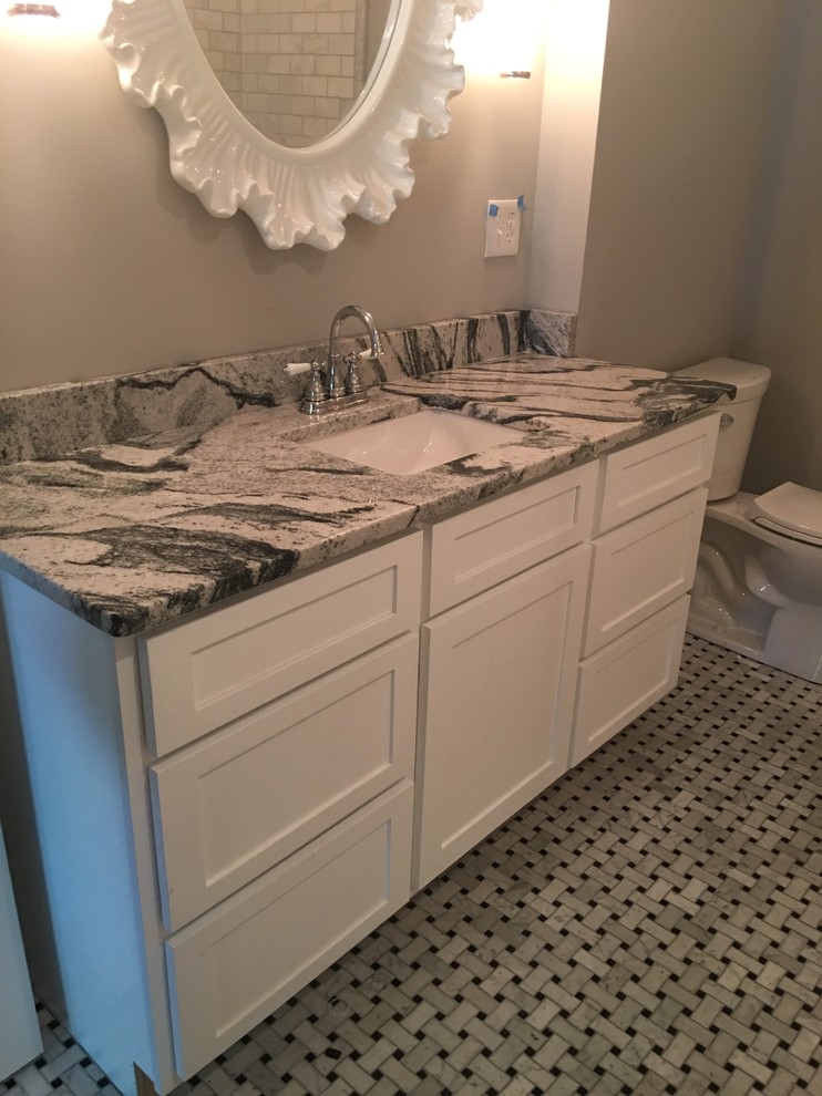 Inspiration for a mid-sized transitional 3/4 bathroom remodel in Atlanta with white cabinets, gray walls, an undermount sink, recessed-panel cabinets and a two-piece toilet