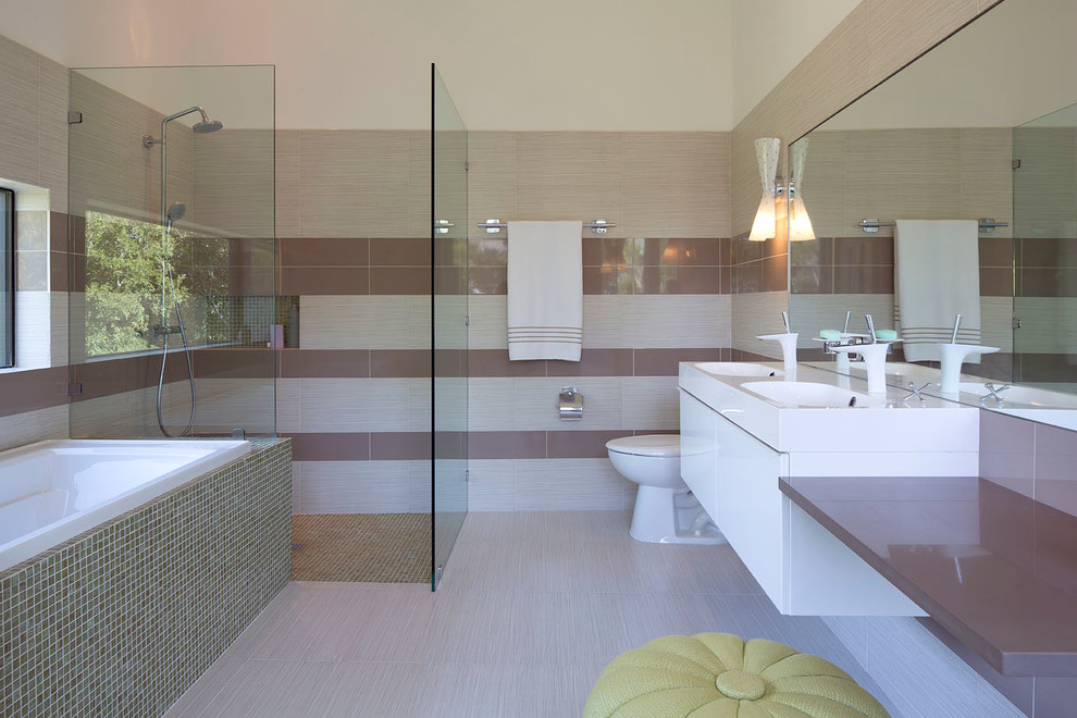 Small trendy master beige tile and ceramic tile ceramic tile bathroom photo in Austin with an integrated sink, flat-panel cabinets, white cabinets, quartzite countertops, a one-piece toilet and white walls