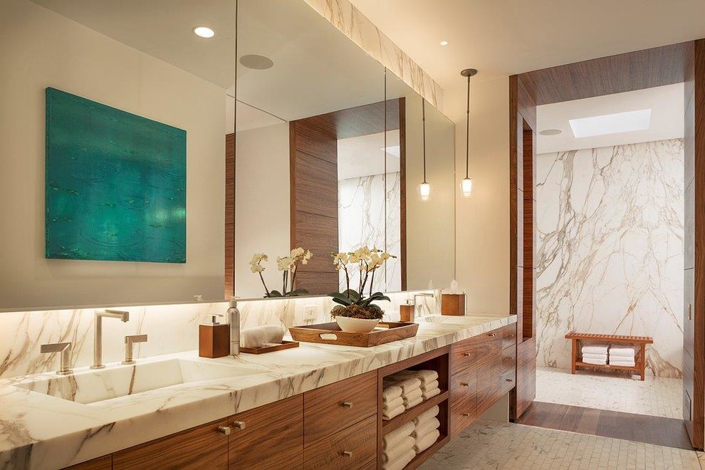 Large trendy beige tile alcove shower photo in San Francisco with an integrated sink, flat-panel cabinets, medium tone wood cabinets and beige walls