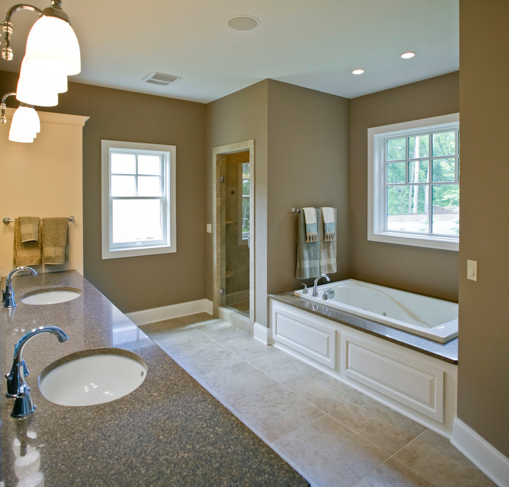 Elegant master slate floor bathroom photo in Grand Rapids with a drop-in sink, granite countertops and brown walls