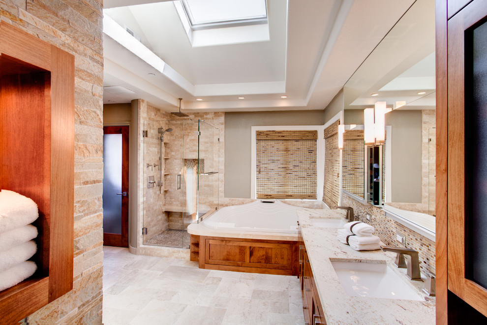 Large tuscan master beige tile and stone tile limestone floor bathroom photo in San Francisco with an undermount sink, shaker cabinets, medium tone wood cabinets, granite countertops and gray walls