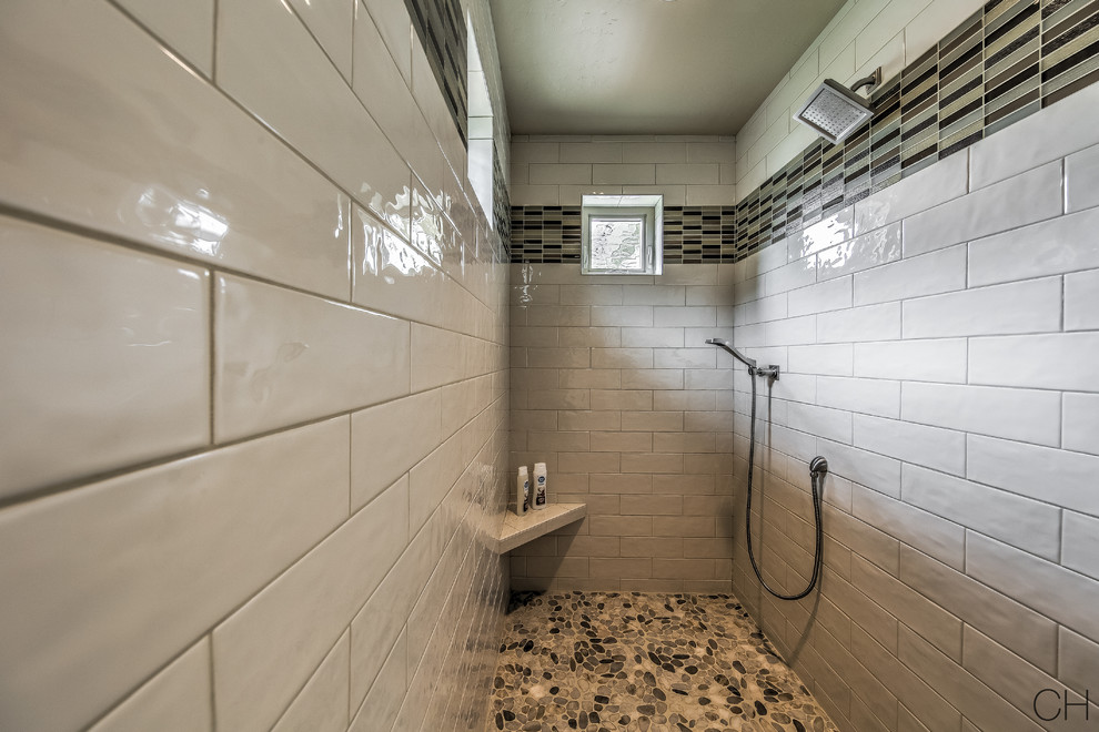 Inspiration for a medium sized traditional ensuite bathroom in Orange County with raised-panel cabinets, white cabinets, an alcove bath, an alcove shower, a one-piece toilet, beige tiles, black tiles, black and white tiles, white tiles, porcelain tiles, beige walls, ceramic flooring, a submerged sink, granite worktops, beige floors and an open shower.