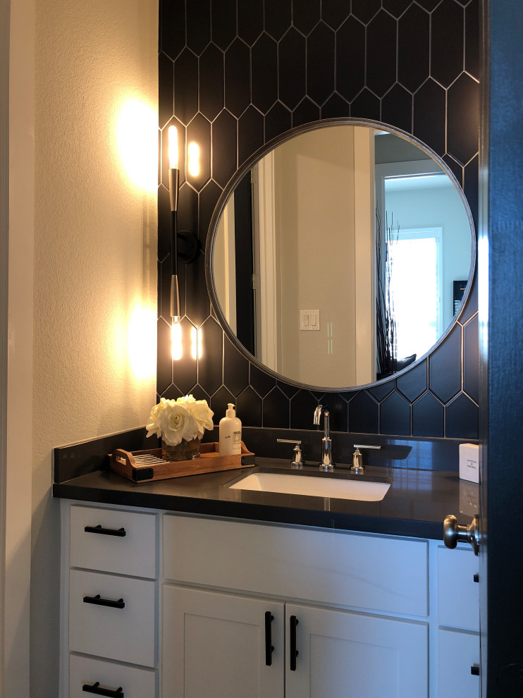 Small modern shower room bathroom in Houston with shaker cabinets, white cabinets, black tiles, porcelain tiles, grey walls, porcelain flooring, a submerged sink, engineered stone worktops, grey floors, black worktops, an enclosed toilet, a single sink and a built in vanity unit.