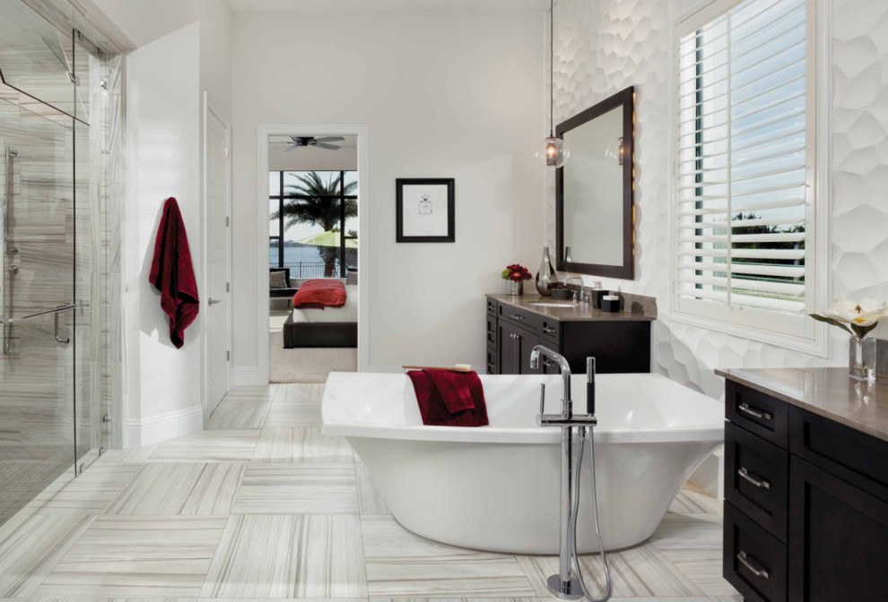 Large contemporary ensuite bathroom in San Diego with shaker cabinets, dark wood cabinets, a freestanding bath, an alcove shower, white walls, a submerged sink, white tiles, porcelain tiles, vinyl flooring, marble worktops, white floors and a hinged door.