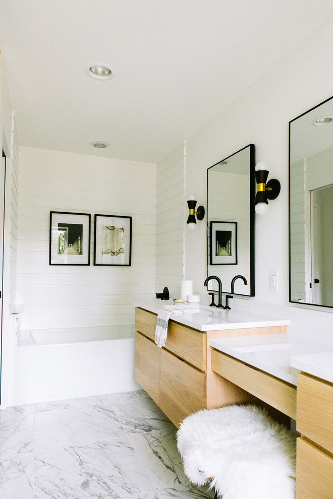 Inspiration for a classic bathroom in Other with flat-panel cabinets, medium wood cabinets, an alcove bath, white tiles, white walls, a submerged sink and white floors.