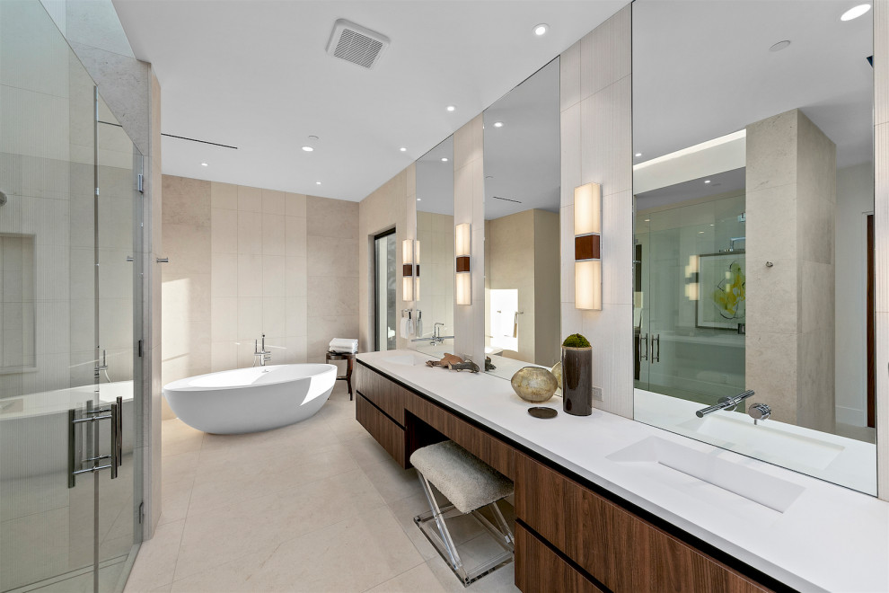 Идея дизайна: ванная комната в современном стиле с плоскими фасадами, темными деревянными фасадами, отдельно стоящей ванной, серой плиткой, монолитной раковиной, серым полом, белой столешницей, тумбой под две раковины и подвесной тумбой