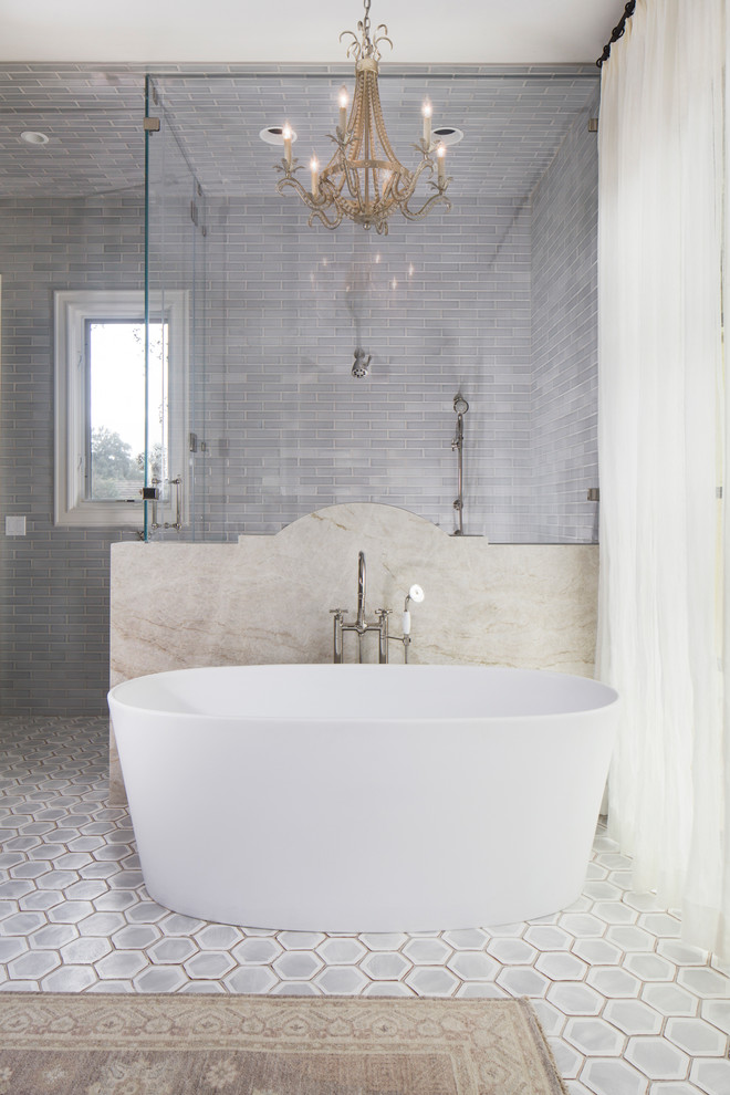 Inspiration for a large traditional family bathroom in Austin with a freestanding bath, a corner shower, ceramic tiles, grey walls, terracotta flooring, grey floors and a hinged door.