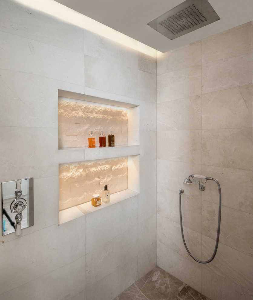Photo of a medium sized classic ensuite bathroom in London with beaded cabinets, white cabinets, an alcove shower, beige tiles, ceramic tiles, ceramic flooring, a built-in sink, marble worktops, brown floors, an open shower and white worktops.