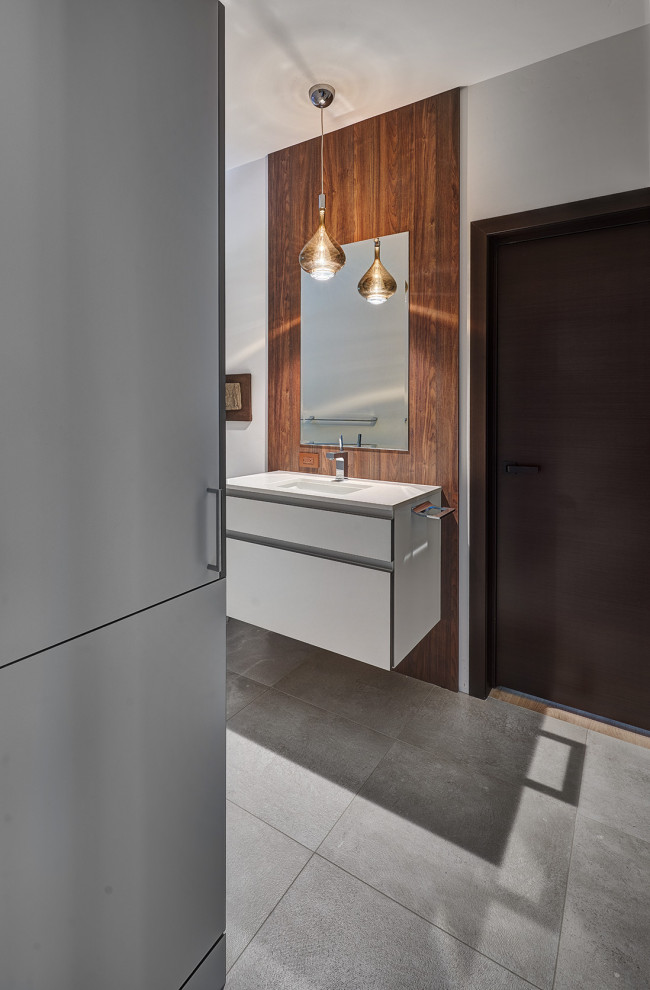 Huge 3/4 wood-look tile cement tile floor, multicolored floor and single-sink bathroom photo in Sacramento with flat-panel cabinets, white cabinets, white walls, an undermount sink, quartz countertops, white countertops and a floating vanity
