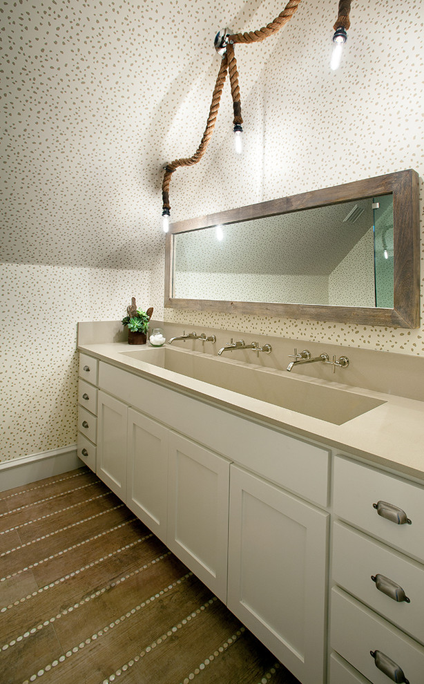 Example of a transitional medium tone wood floor bathroom design in Dallas with white cabinets and white walls