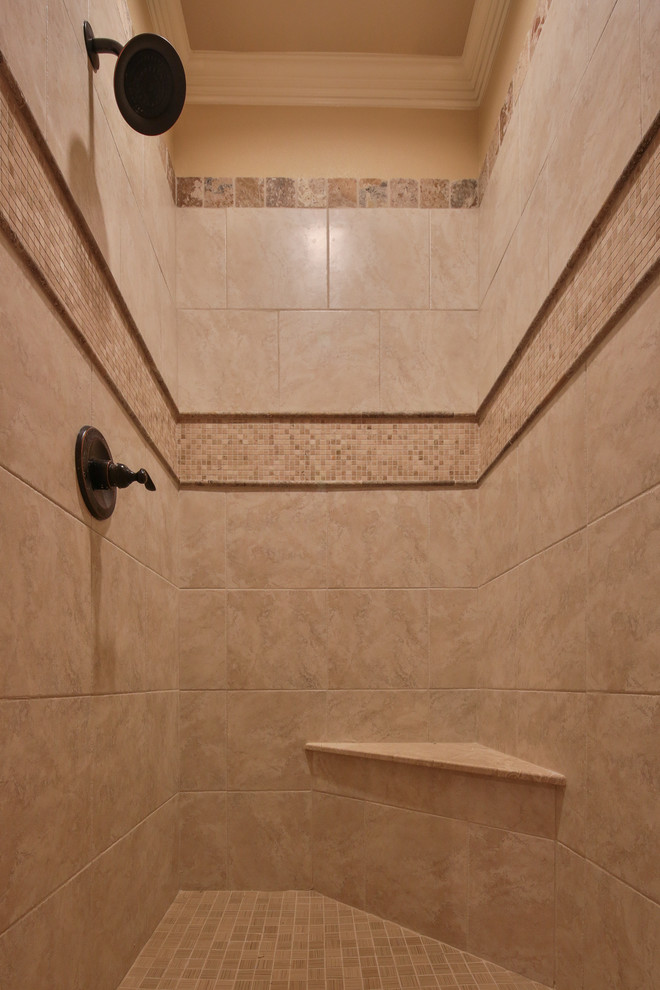 This is an example of a large traditional ensuite bathroom in Dallas with raised-panel cabinets, white cabinets, a built-in bath, beige tiles, mosaic tiles, beige walls, travertine flooring, a submerged sink, granite worktops and an alcove shower.