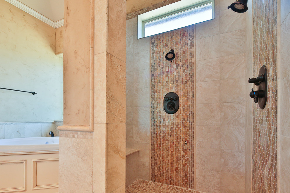 Large traditional ensuite bathroom in Dallas with raised-panel cabinets, white cabinets, a built-in bath, an alcove shower, beige tiles, mosaic tiles, beige walls, travertine flooring, a submerged sink and granite worktops.