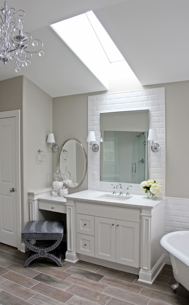 Example of a large transitional master white tile and cement tile porcelain tile bathroom design in Milwaukee with an undermount sink, shaker cabinets, white cabinets, quartzite countertops, a one-piece toilet and beige walls