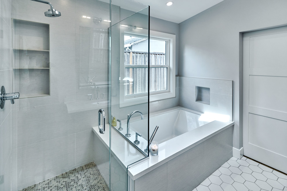 Inspiration for a rural ensuite bathroom in San Francisco with a corner bath, a corner shower, grey tiles, ceramic tiles, grey walls, ceramic flooring, a built-in sink, white floors and a hinged door.