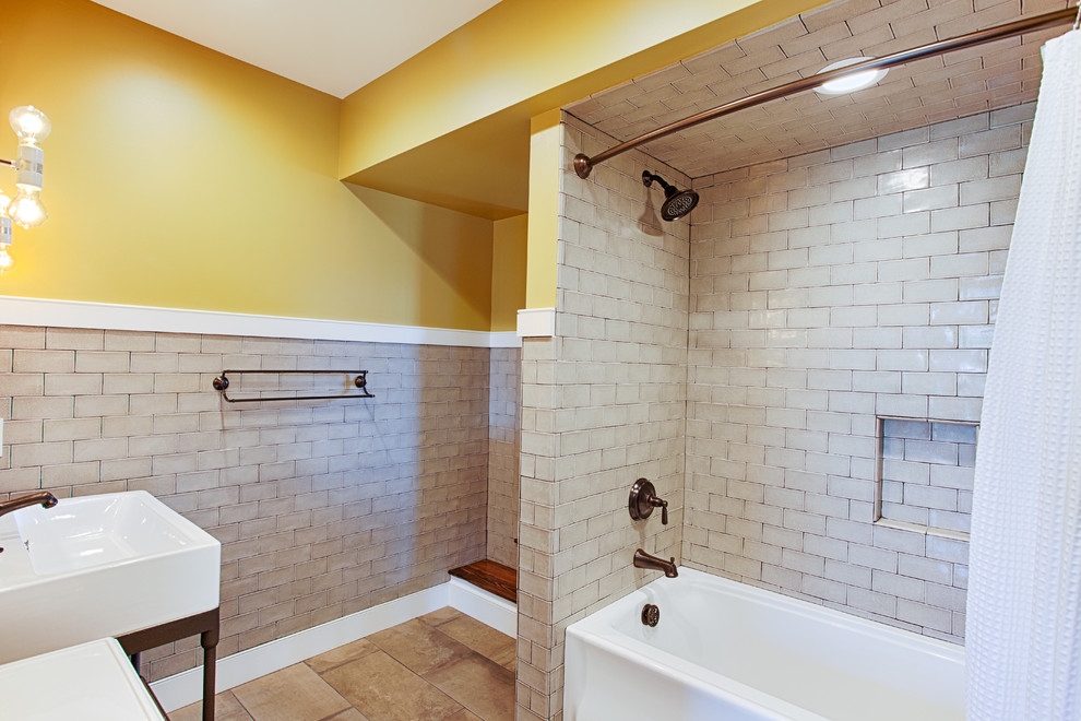 Design ideas for a large contemporary family bathroom in Philadelphia with a submerged sink, an alcove bath, an alcove shower, a one-piece toilet, beige tiles, metro tiles, yellow walls, porcelain flooring and freestanding cabinets.