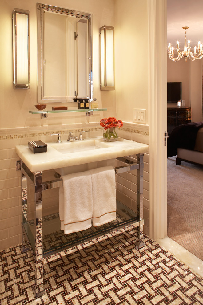 This is an example of a traditional bathroom in New York with metro tiles, mosaic tile flooring and feature lighting.