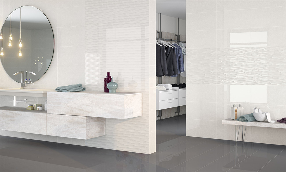 Idee per una stanza da bagno design con piastrelle bianche e pareti bianche