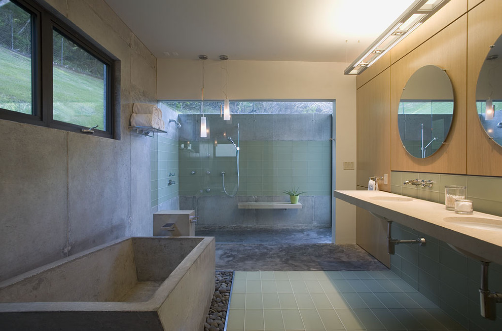 Ejemplo de cuarto de baño cemento moderno con lavabo bajoencimera