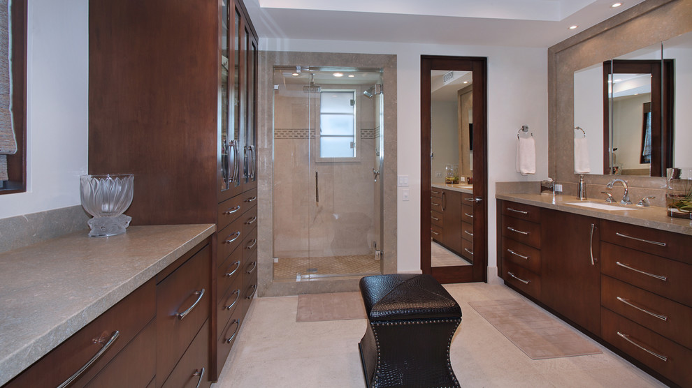 Example of a large trendy brown tile and ceramic tile ceramic tile alcove shower design in Orange County with a drop-in sink, flat-panel cabinets, dark wood cabinets, granite countertops and white walls