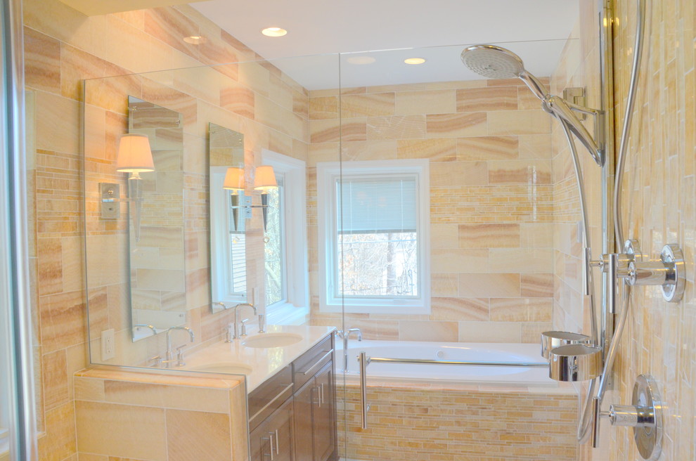 Inspiration for a contemporary drop-in bathtub remodel in Minneapolis