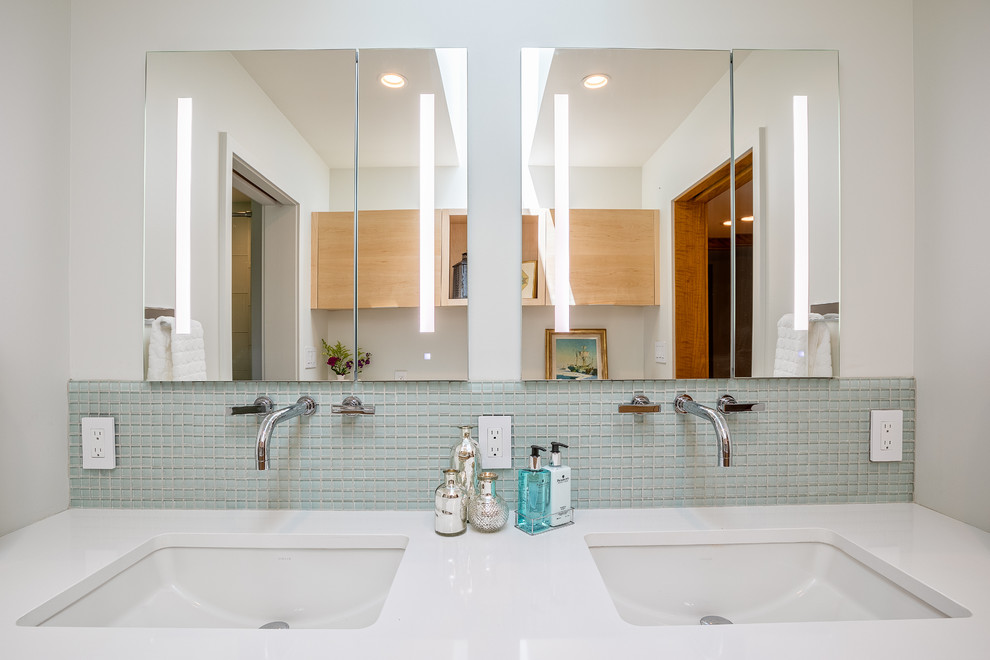 Example of a mid-sized transitional master glass tile and blue tile slate floor and gray floor bathroom design in Detroit with flat-panel cabinets, light wood cabinets, white walls, an undermount sink, quartzite countertops, a hinged shower door, a wall-mount toilet and white countertops