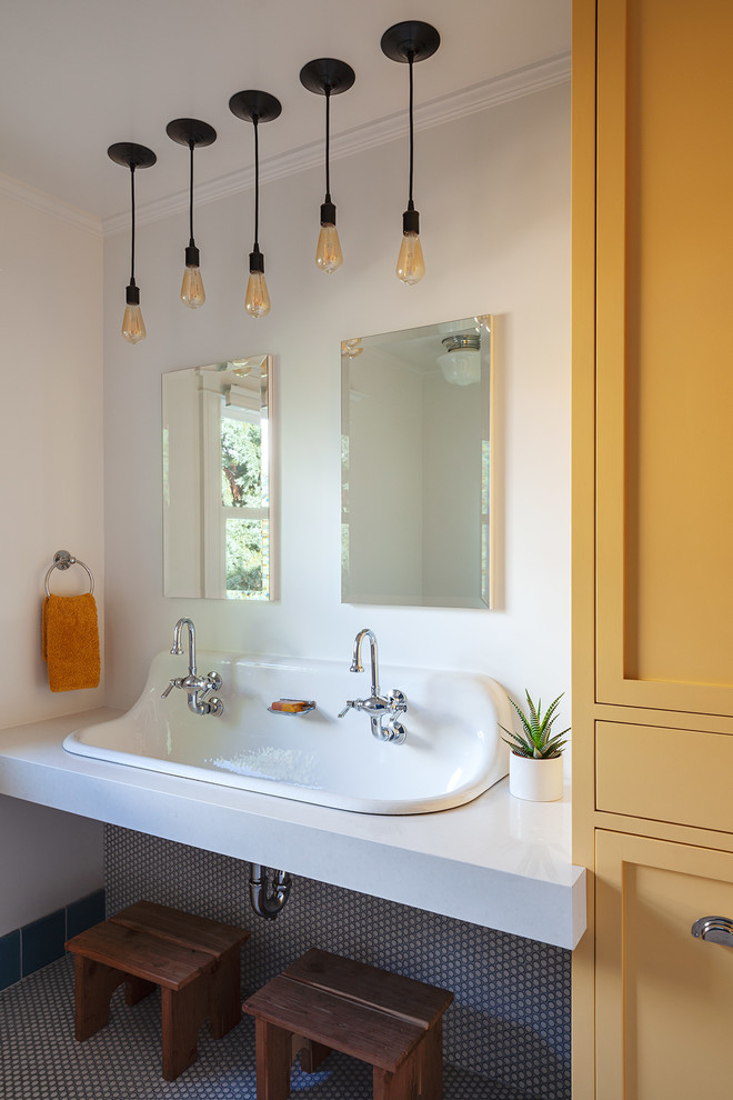 Design ideas for a classic family bathroom in San Francisco with shaker cabinets, yellow cabinets, white walls, a trough sink, multi-coloured floors and grey worktops.