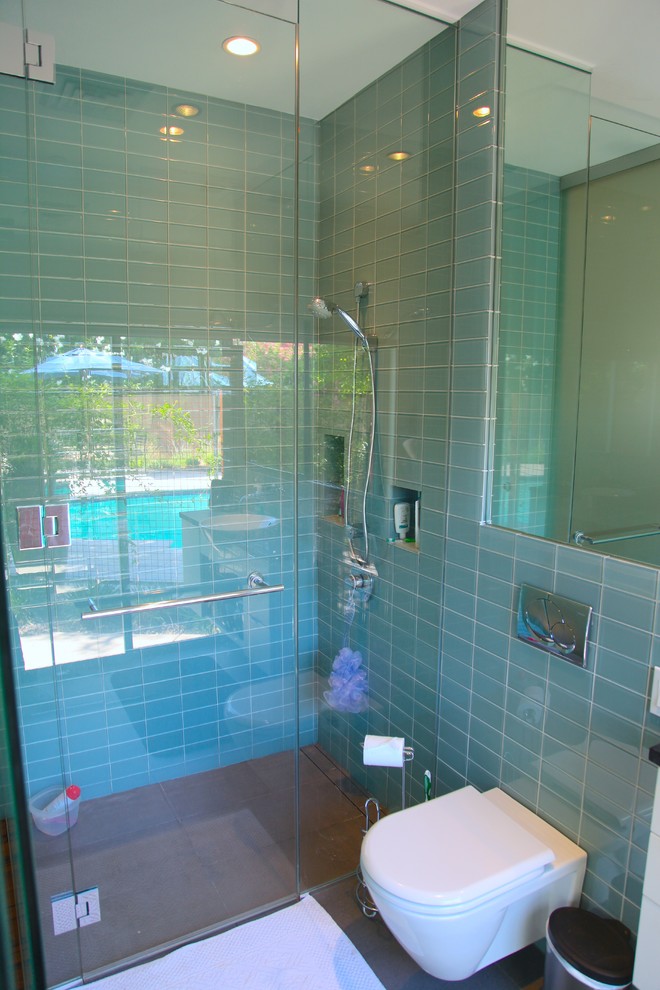 Design ideas for a medium sized contemporary family bathroom in Phoenix with blue tiles and glass tiles.