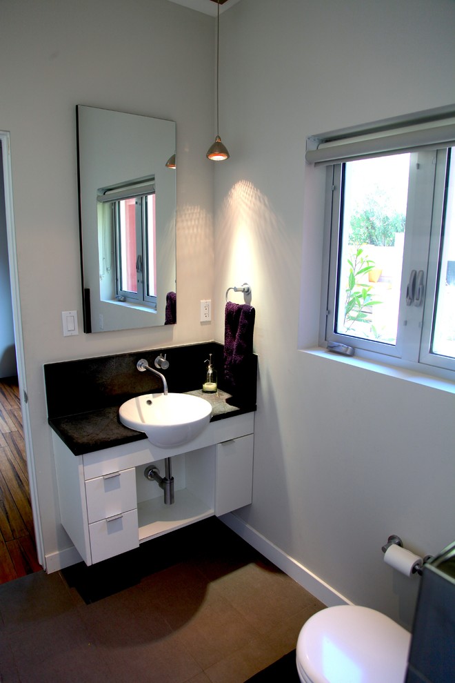This is an example of a small contemporary family bathroom in Phoenix with grey tiles.
