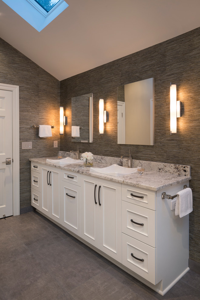 Bathroom - large transitional master beige tile and ceramic tile porcelain tile and gray floor bathroom idea in Milwaukee with recessed-panel cabinets, white cabinets, a two-piece toilet, beige walls, a drop-in sink and granite countertops