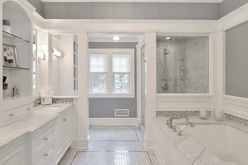 Inspiration for a large classic ensuite bathroom in New York with white cabinets, grey tiles, grey walls and recessed-panel cabinets.