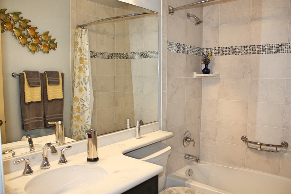 Small classic family bathroom in San Diego with shaker cabinets, dark wood cabinets, an alcove bath, a shower/bath combination, a two-piece toilet, grey tiles, ceramic tiles, blue walls, porcelain flooring, a submerged sink, engineered stone worktops, grey floors and a shower curtain.