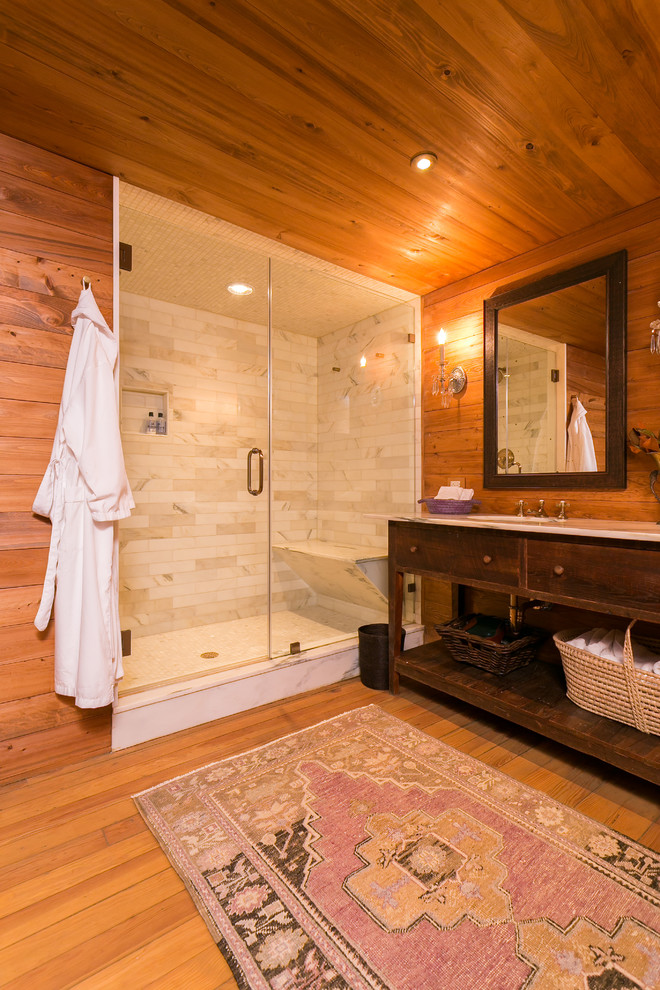 Esempio di una stanza da bagno di medie dimensioni con consolle stile comò, ante in legno bruno e piastrelle grigie
