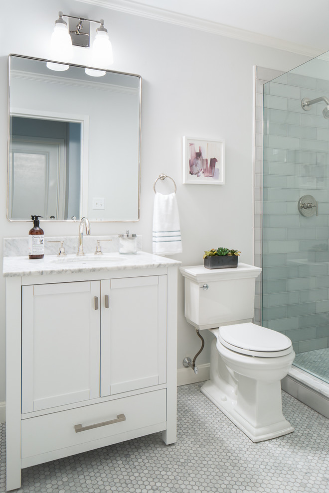 Small contemporary ensuite bathroom in Boston with shaker cabinets, white cabinets, a corner shower, a one-piece toilet, mosaic tiles, white walls, a submerged sink, grey tiles, marble flooring, marble worktops, grey floors, a hinged door and grey worktops.