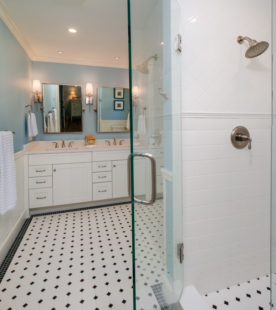 Medium sized classic shower room bathroom in Other with recessed-panel cabinets, white cabinets, metro tiles, engineered stone worktops, white floors, a hinged door, an alcove shower, white tiles, blue walls, ceramic flooring, a submerged sink and white worktops.