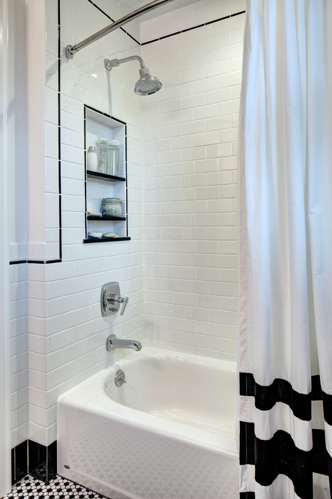 Photo of a small traditional bathroom in New York with a submerged sink, shaker cabinets, white cabinets, engineered stone worktops, an alcove bath, a shower/bath combination, a two-piece toilet, white tiles, ceramic tiles, white walls and ceramic flooring.