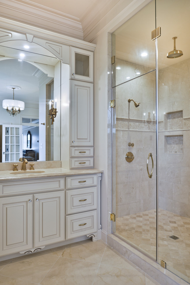 Inspiration for a mid-sized modern master white tile marble floor and beige floor double shower remodel in DC Metro with white cabinets, a hot tub, a one-piece toilet, white walls, an undermount sink, a hinged shower door and beige countertops