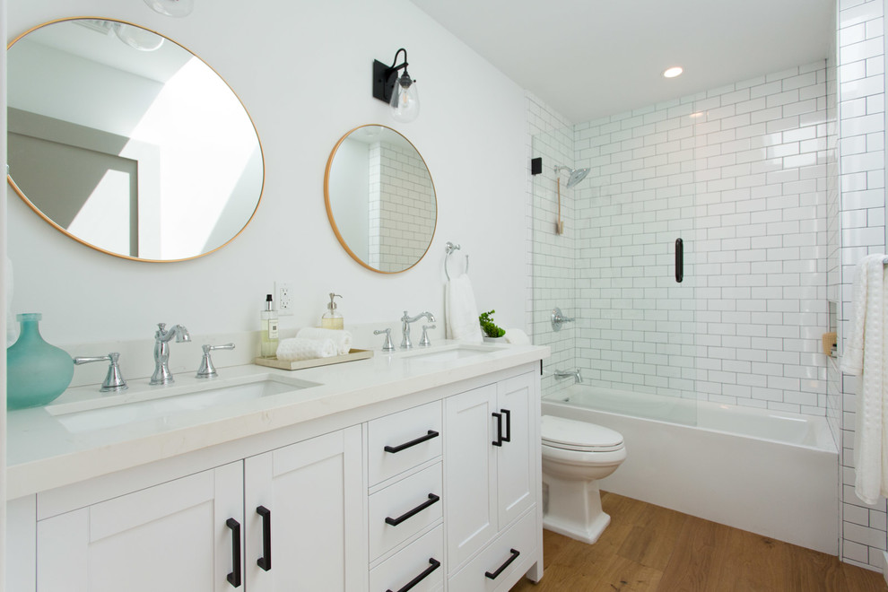 Example of a mid-sized cottage kids' white tile and subway tile alcove bathtub design in Los Angeles with shaker cabinets, white cabinets, white walls and quartz countertops