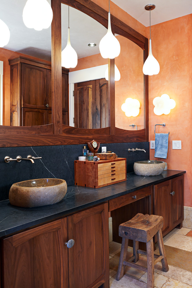 Inspiration for a large rustic master alcove shower remodel in Other with a vessel sink, soapstone countertops, orange walls, recessed-panel cabinets, a hinged shower door and blue countertops