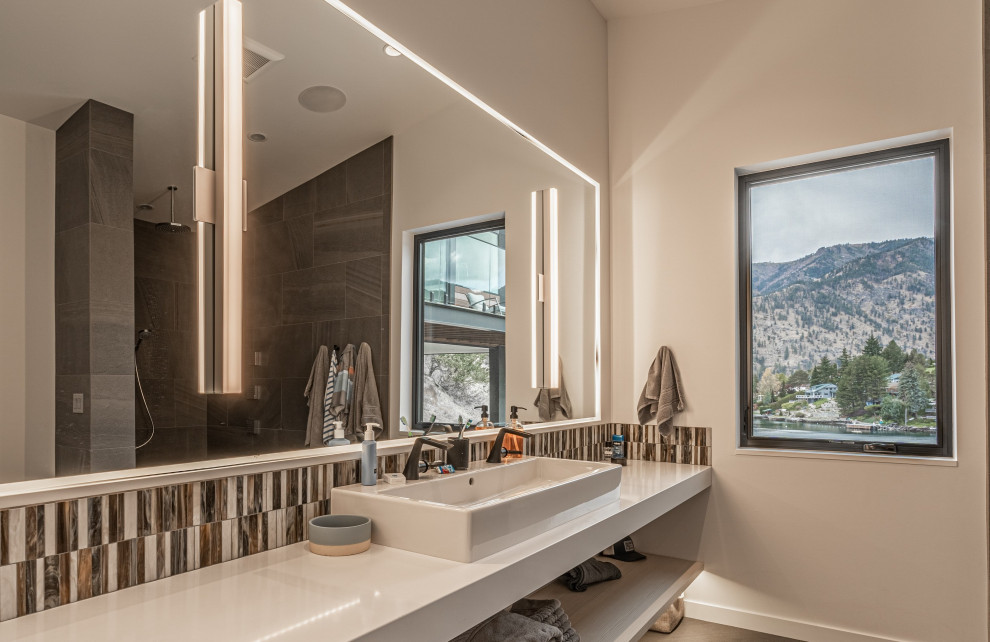 Inspiration for a medium sized modern ensuite bathroom in Seattle with white cabinets, a walk-in shower, multi-coloured tiles, porcelain tiles, white walls, porcelain flooring, a vessel sink, solid surface worktops, beige floors, an open shower, white worktops, a single sink and a floating vanity unit.