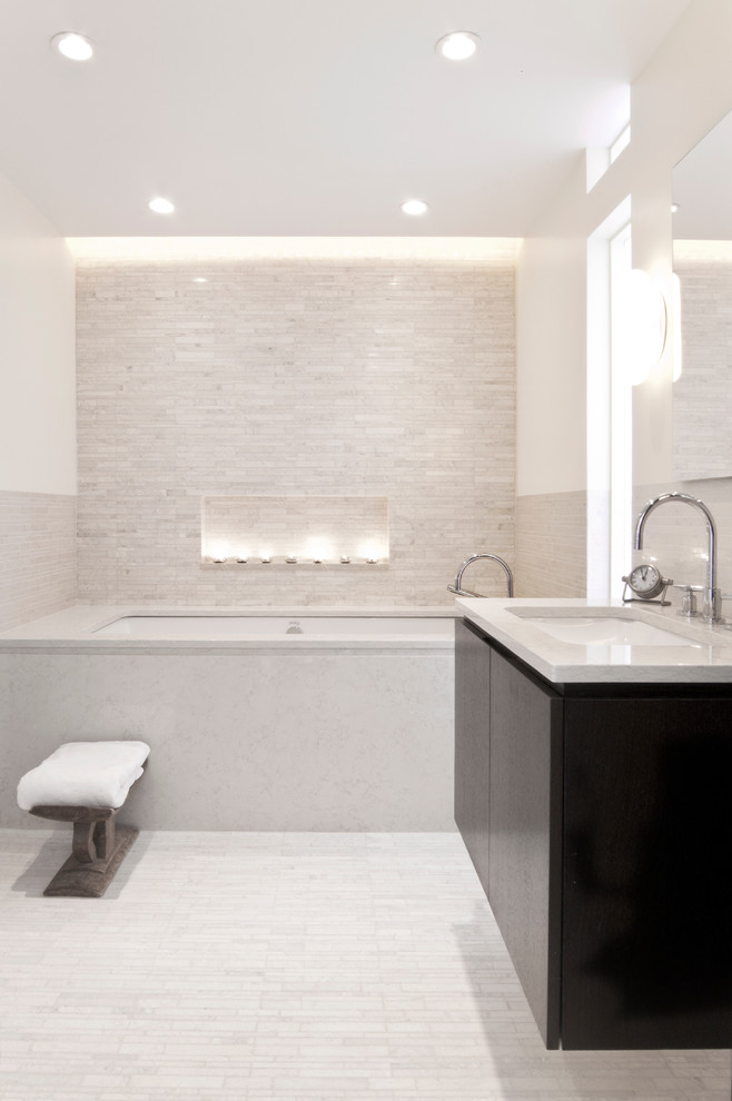 Bathroom - mid-sized modern 3/4 beige tile and glass tile porcelain tile and beige floor bathroom idea in New York with flat-panel cabinets, black cabinets, an undermount tub, white walls, an undermount sink and quartzite countertops