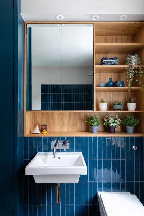 Transcending Trends: A Transitional Bathroom Oasis with Blue Glass and Wood Recessed Niche