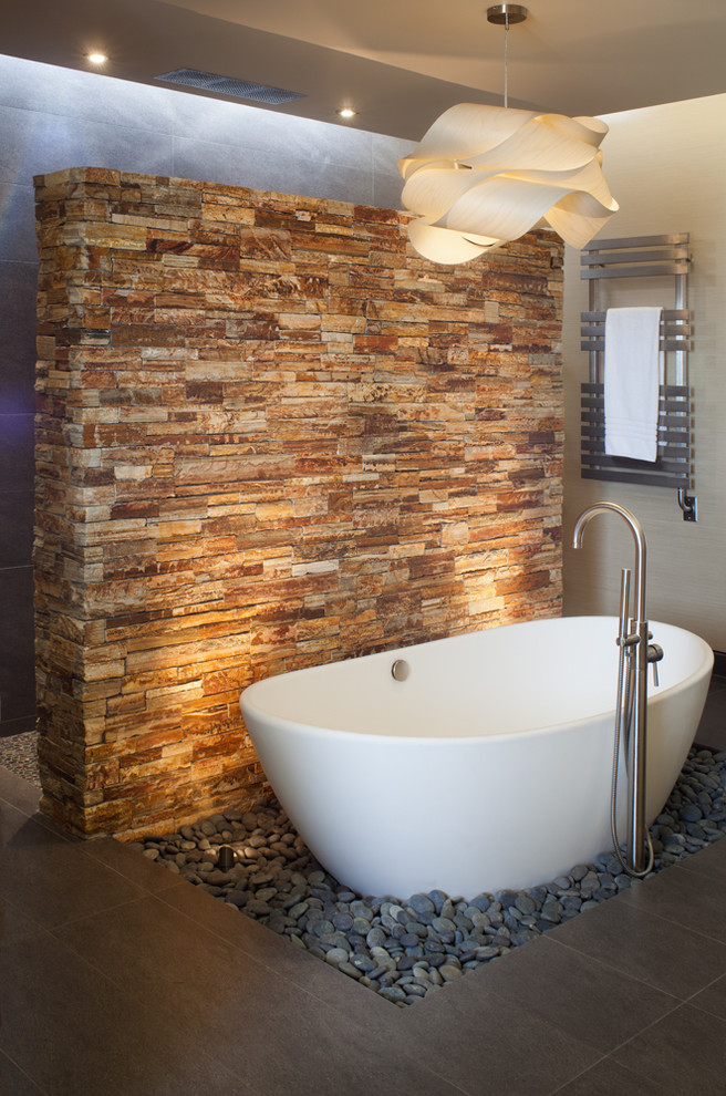 Photo of a world-inspired bathroom in San Diego with a freestanding bath.