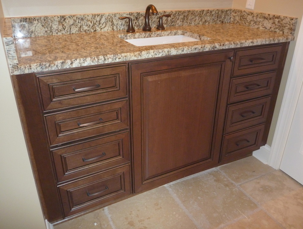 Elegant bathroom photo in Atlanta with raised-panel cabinets and granite countertops