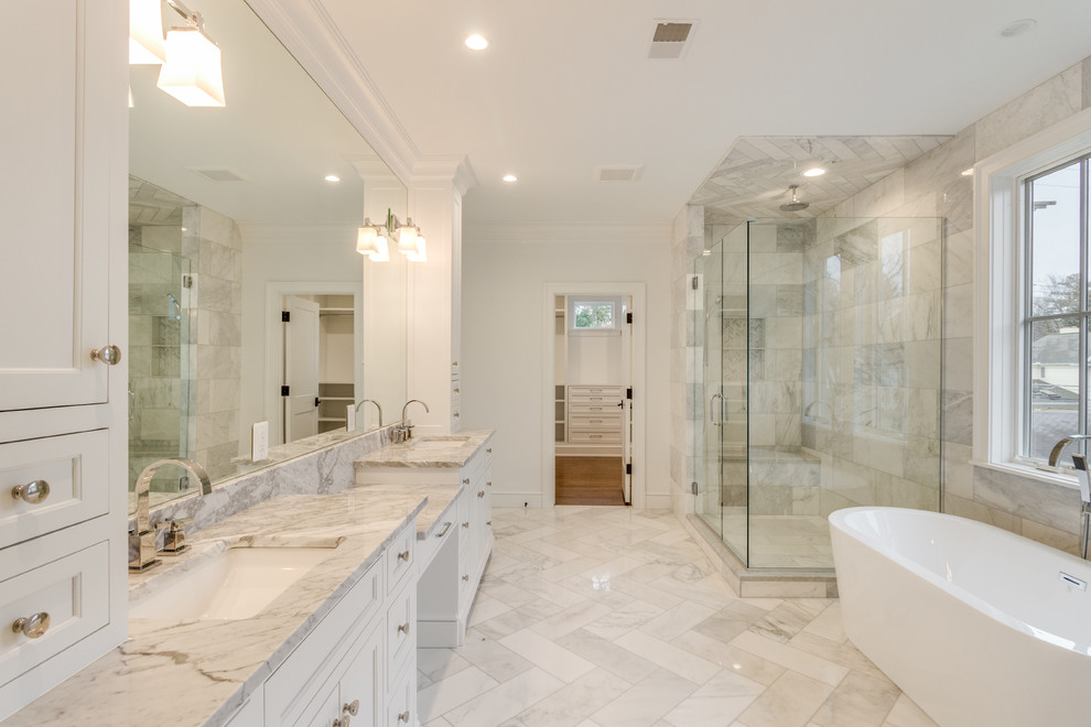 Transitional master gray tile and metal tile marble floor and gray floor bathroom photo in Detroit with shaker cabinets, white cabinets, white walls, an undermount sink, marble countertops, a hinged shower door and gray countertops
