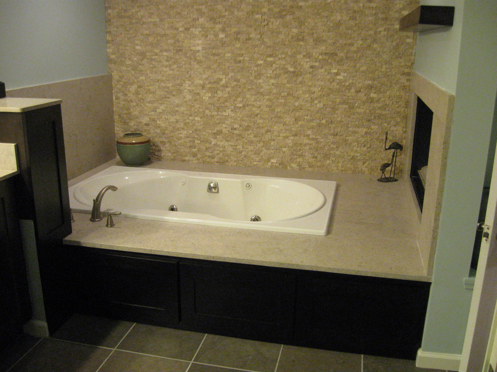 Design ideas for a large contemporary ensuite bathroom in St Louis with a submerged sink, flat-panel cabinets, dark wood cabinets, a built-in bath, a two-piece toilet, green tiles, stone tiles, blue walls and slate flooring.