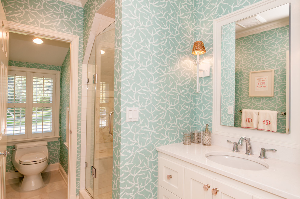 Inspiration for a small coastal kids' green tile marble floor corner shower remodel in DC Metro with an undermount sink, recessed-panel cabinets, white cabinets, granite countertops, a one-piece toilet and green walls